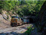 CSX 903 leads westbound stacks out of the Stuart Tunnel
